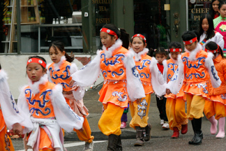 Chinese New Year Kids in orange costumes
