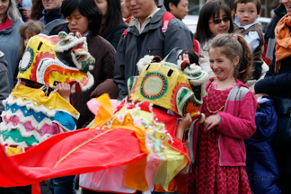 Chinese New Year Parade dragon and child